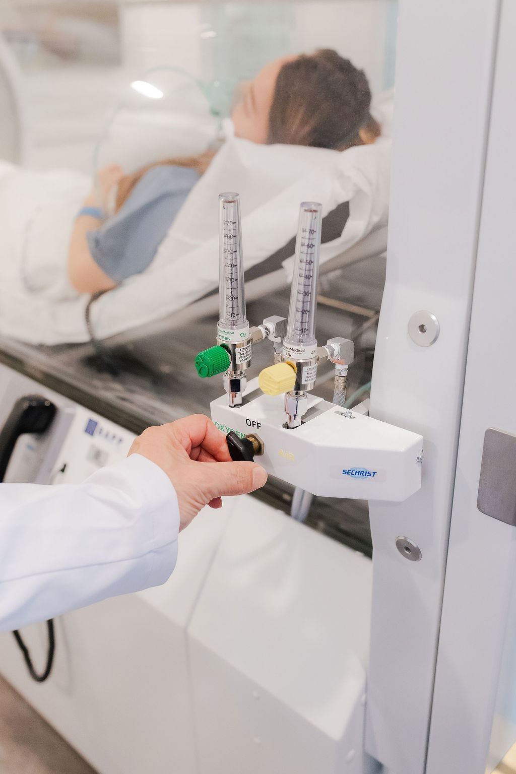 Professional hyperbaric oxygen therapy treatment with medical supervision at The Gift MedSpa HBOT facility in Ridgefield Connecticut showing patient receiving HBOT treatment